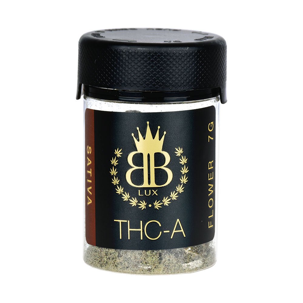 Glass jar of Budzburn Lux THCA Flower with gold crown logo and granular substance