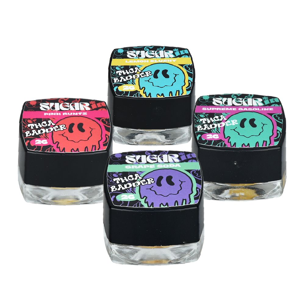 Four Juicy Rascals containers with smiley lids showcasing Stigur’s THCA Badder Live Resin