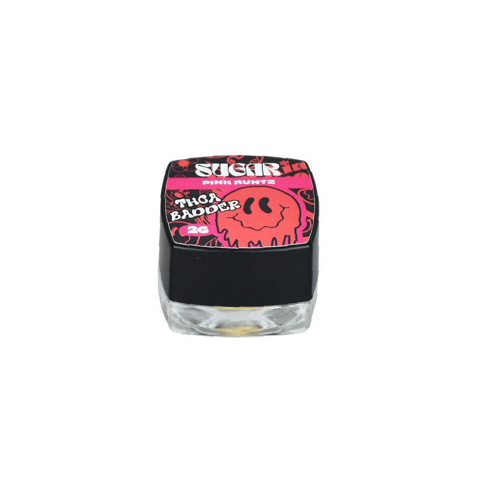 Small glass jar with black lid and pink smiley design, perfect for THCA Badder Live Resin