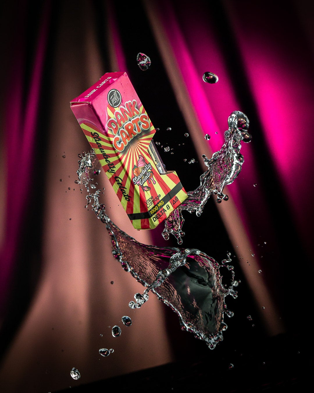 Colorful candy box splashing in water with PUFF XTRAX Strawberry Gelato Vape Cartridge