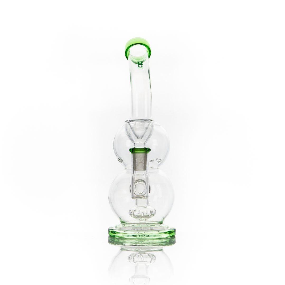 Glass water pipe with green accents and spherical base for the Hemper Tornado Rig